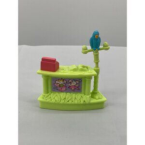 Fisher Price Sweet Streets Pet Shop Counter with a parrot